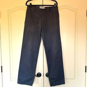 Grey khakis. Soft, brushed finish. Plain front.